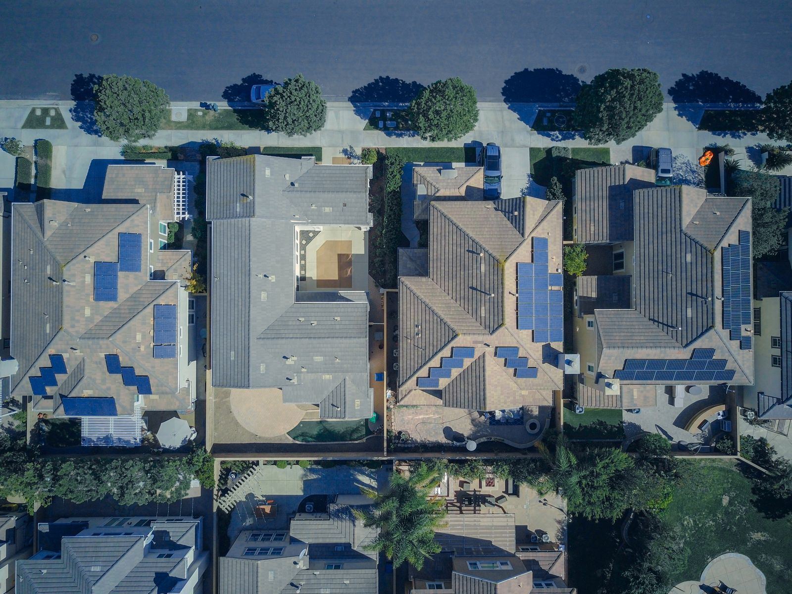 Rooftop solar panels on homes in a desert neighborhood